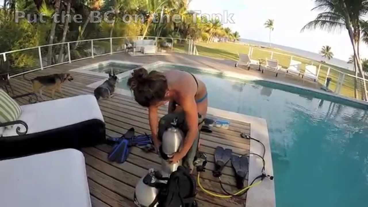 Cute Girl Setting Up Dive Gear