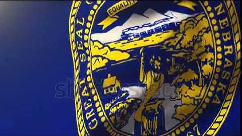 nebraska flag waving in the wind. Looping sun rises style. Animation loop Stock video by