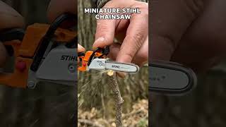 stihl minichainsaw cutting wooden stick