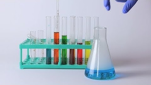 Laboratory Flasks and Beakers on the Table | Stock Footage - Videohive
