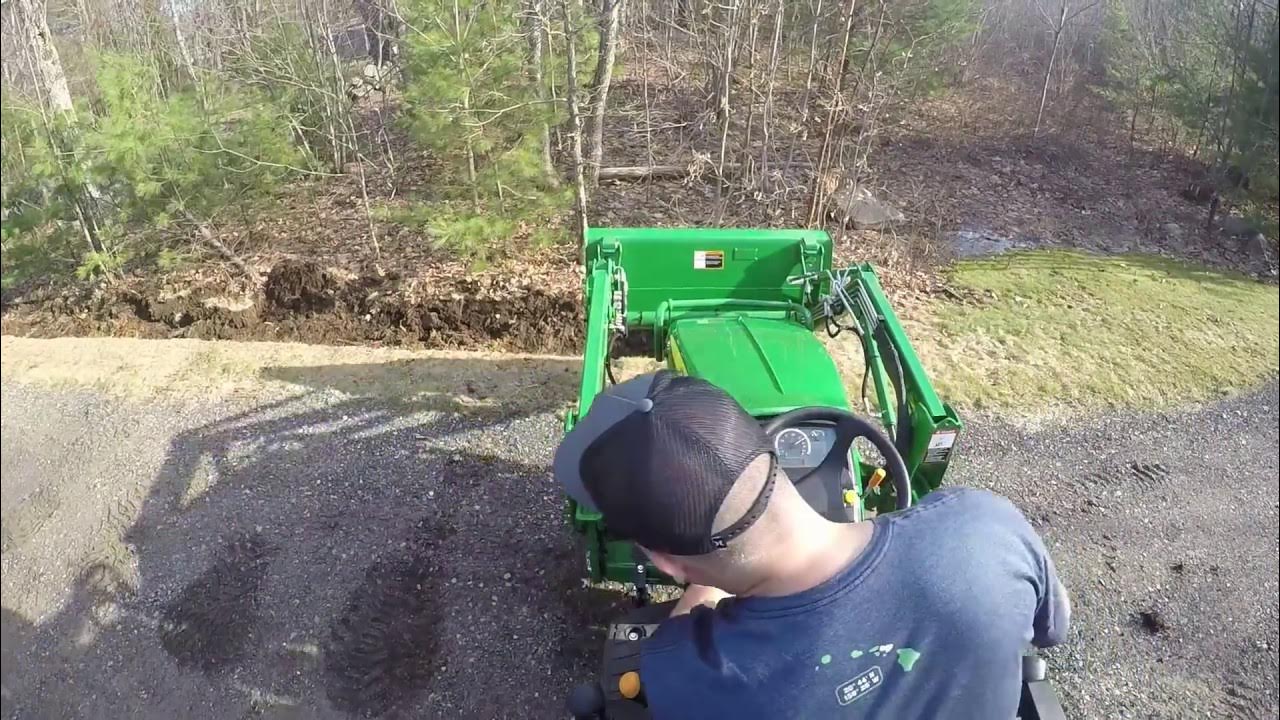 John Deere 1025r Front end loader digging a ditch YouTube