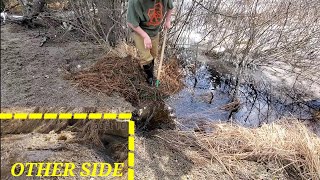 Unclogging Culvert And Breaking Water Bubble In Grass