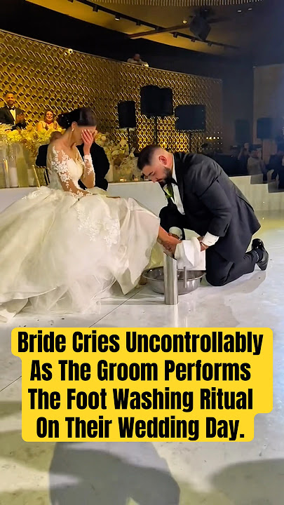 Bride Cries Uncontrollably As The Groom Performs The Foot Washing Ritual On Their Wedding Day.