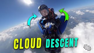 Wingsuit Pilot and Passenger Descend Through the Clouds