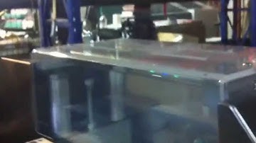 Card Feeder connected to a Delfin flow wrapper with dispensary