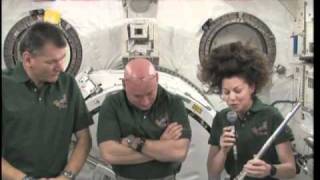 Astronaut Cady Coleman plays flute on space station