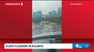 Massive flooding trap drivers in cars in Downtown Atlanta interstates