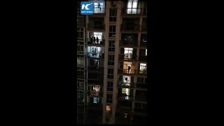 Wuhan residents chant 