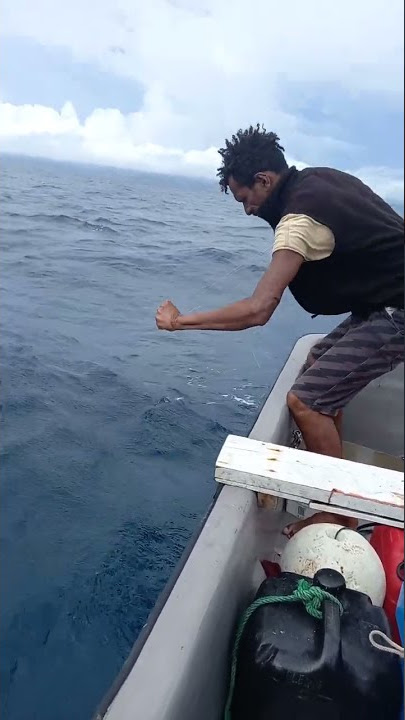 Coral Trout line fishing PNG, Central Province, Gaba Gaba Village. Bare hands