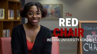 Sport and Recreation Management major, Nicole Robinson, has a seat in The Red Chair
