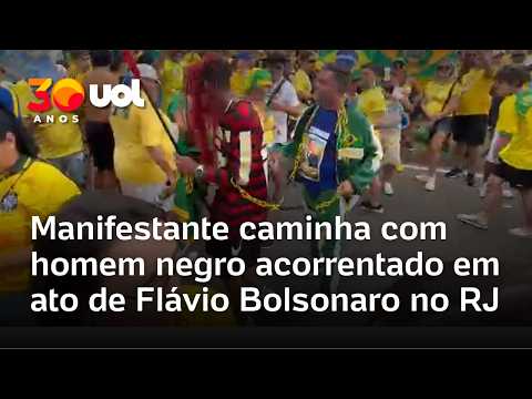 Bolsonaro supporter walks with chained Black man dressed as a PT supporter at Flávio rally