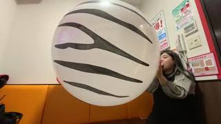 Lady Blows To Pop A Huge Huge Balloon