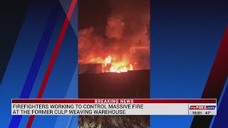 Firefighters battling massive fire at former Culp Weave warehouse in Graham