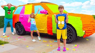 Макс и Катя обклеили цветными наклейками машину папы