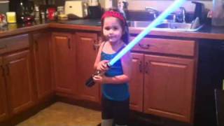 Celebrity Avi, young Padawan, shows off her light saber skills. Wealth