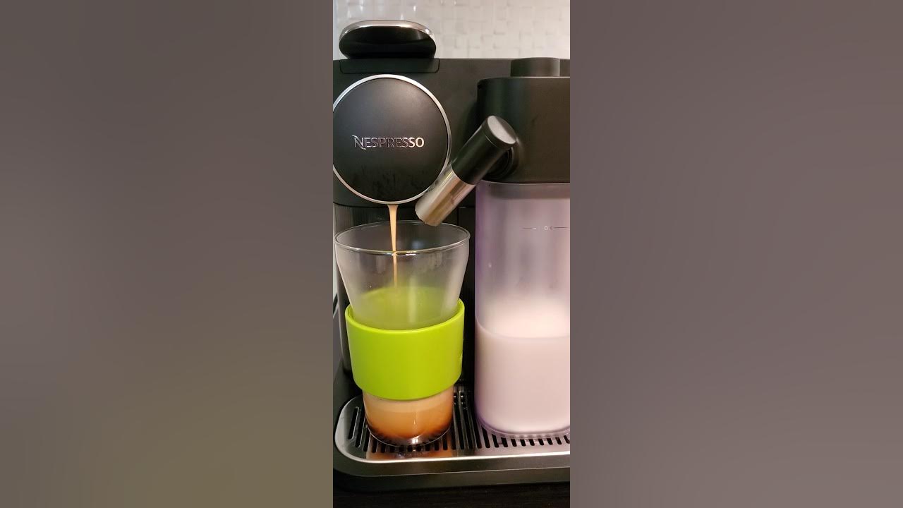 Nespresso Gran Lattissima Making caffe latte with cleaning milk frother