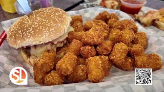 Dig into delicious cheeseburgers, chili dogs and milkshakes at Happy's Hamburgers