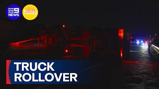Truck rollover brings busy Melbourne motorway to standstill | 9 News Australia