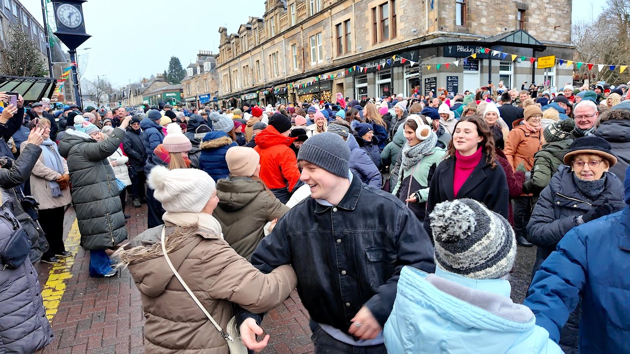 Scottish Ceilidh as crowds join in Dashing White Sergeant at Pitlochry New Year 2026 Street Party