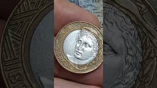 MOEDA DE 1REAL  2002 COM O DEFEITO DE CUNHO DESLOCADO NO ANVERSO E NO REVERSO VALOR$ 200 A 700 REAIS