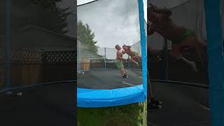 Boys chest bump on trampoline then one boy accidentally knees the other on sensitive area
