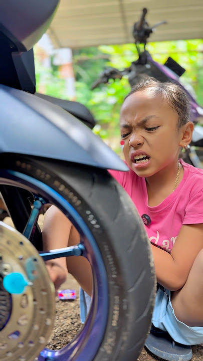 loli stuck in motorbike tire