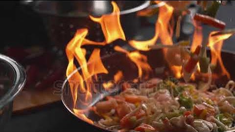 Watch Stir fry into flaming pan in super slow motion, shot on Phan @Einsteinsworldnews