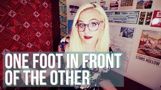 one foot in front of the other