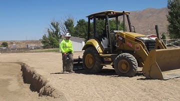 Digging a Trench with the Front Bucket By Operator Hanley