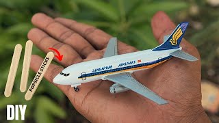 build a model of  Boeing 737-100 Singapore Airlines plane  out of ice cream sticks
