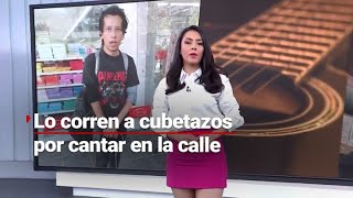 ¡CUIDADO CON EL CRIMINAL! Corren a un joven músico a cubetazos por estar cantando en la vía pública