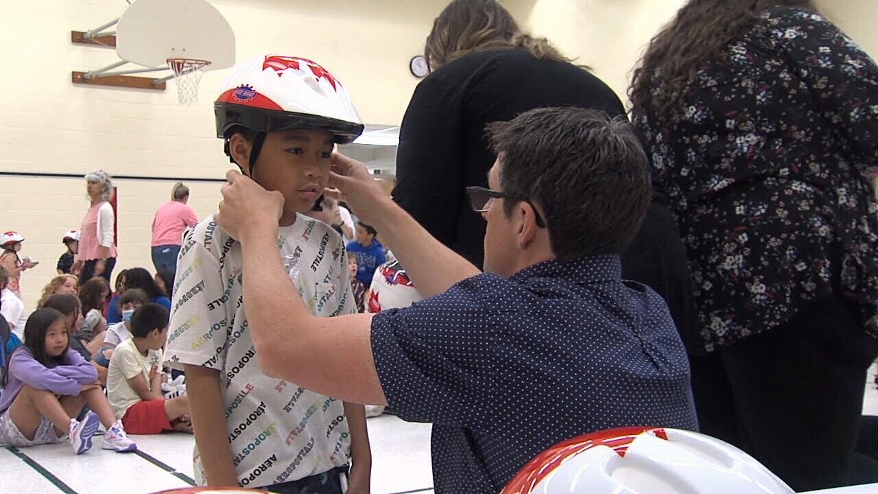 Local lawyers donate bike helmets to students YouTube