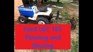 Ford LGT 165 tractor Plowing and discing