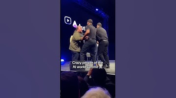 Dude rushing the stage at the ai world summit #ai (not real)
