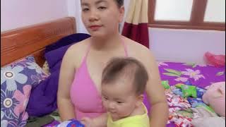 mother takes care of her child at noon. breastfeed your baby