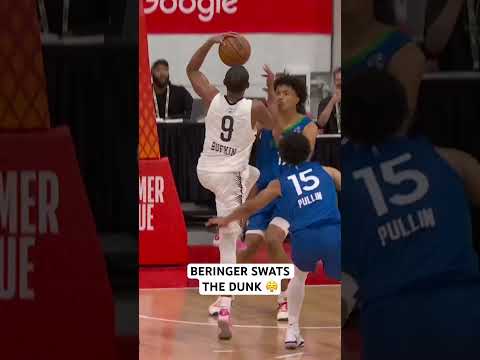 Beringer climbing the ladder to swat away the dunk attempt