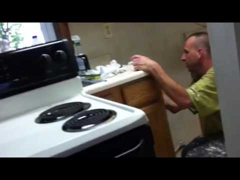 cleaning behind your stove