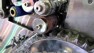 Machine for filling into glass vials and ampoules sealing. Video 1308 www.Pharma-Manager.com