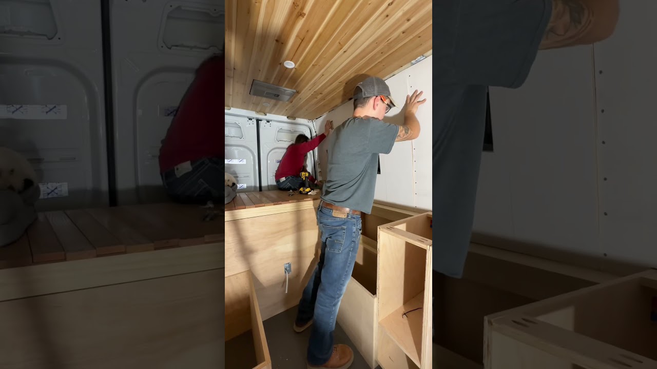 putting up walls in a DIY van build 