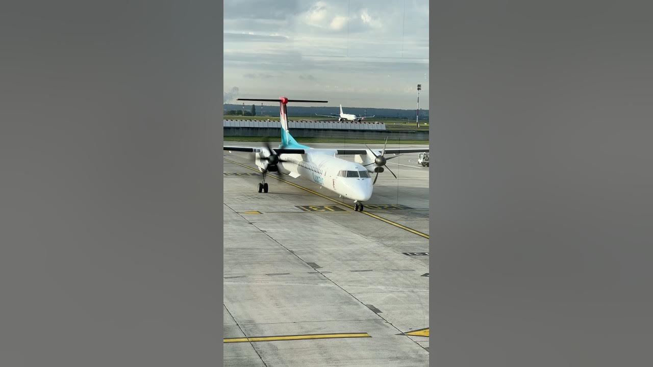 Luxair DHC8Q400 arriving in Charles de Gaulle Airport (CDG) Terminal