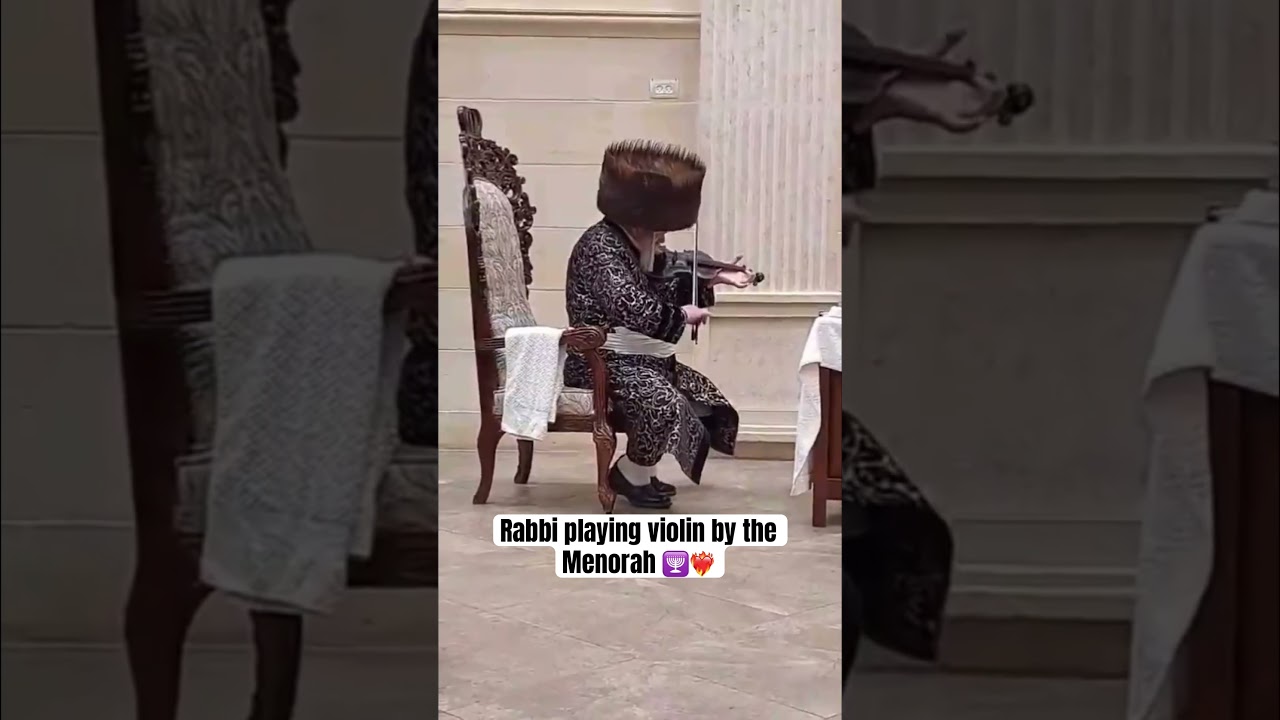 Premishlan Rabbi playing violin by the Menorah 🕎❤️‍🔥
