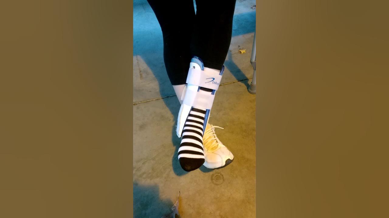 On crutches in the rain at the park YouTube