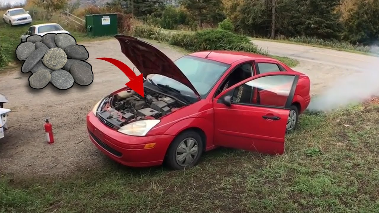 Putting stones to the engine while the car is running - YouTube