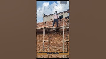 Woman’s Impressive Brick - Catching Skill on Scaffold: Precision in Action