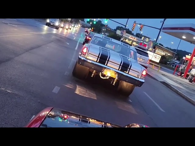 Musclecars caught in a downpour at the cruise night.