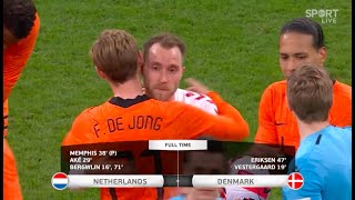 The Dutch and Danish players embrace Christian Eriksen after his brilliant return for Denmark.