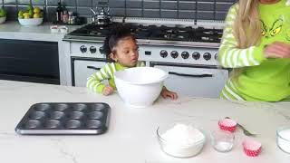 Stormi and Kylie making grinch cupcakes