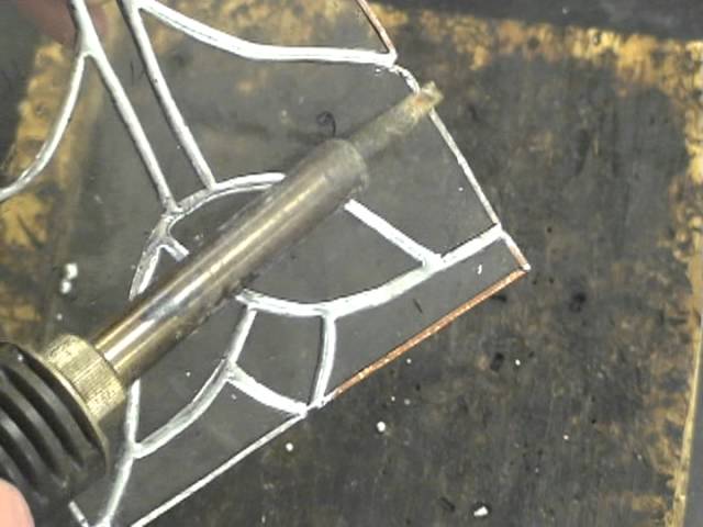 Breaking Out a Score Line on Glass Using a Score Running Pliers 