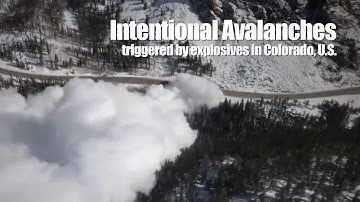 Intentional avalanches triggered by explosives roar down hills in Colorado