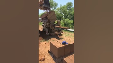 AECT 3500 compressed earth block machine making 8" x 14" CEBs